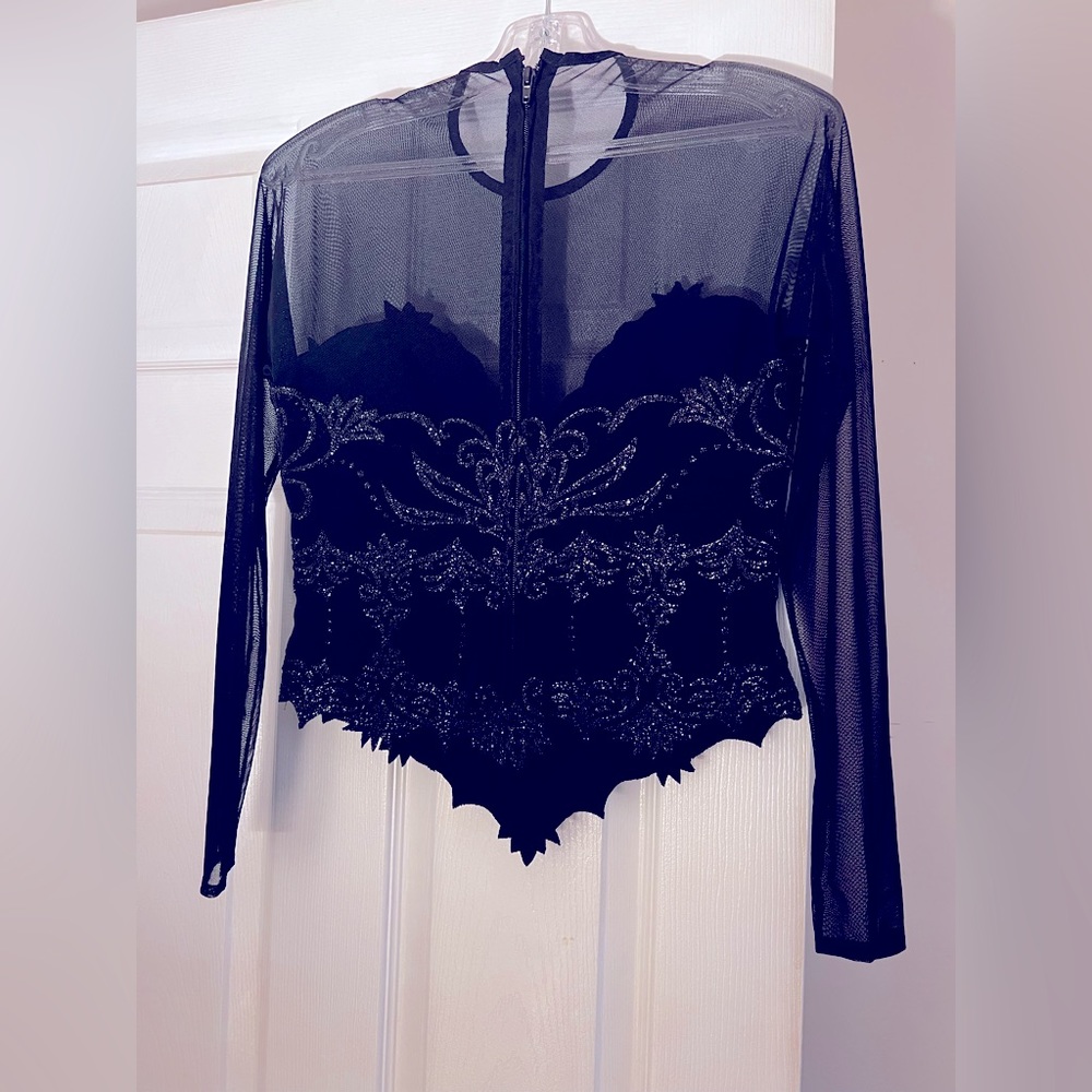 Unique sheer top with solid Corset.  Can be dressed up or down. Unique beading
